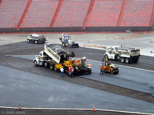 paving a base layer of hot mix asphalt at Aloha Stadium